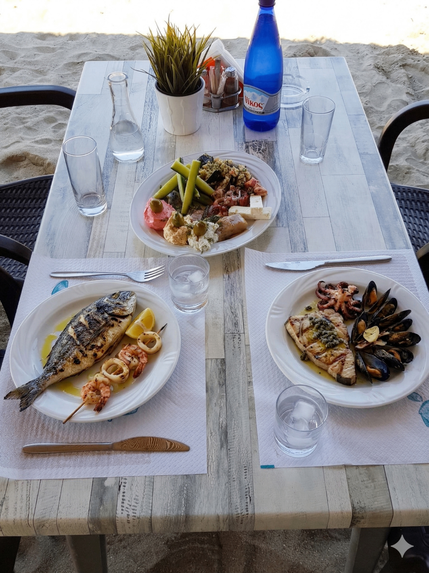 Table with mixed seafood and grilled fish